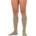 khaki knee-high socks worn by a person on a white background