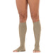 khaki knee-high socks worn by a person on a white background