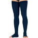 Navy blue compression stockings worn by a person on a white background